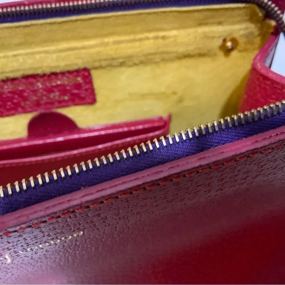 NWOT Aspinal of London red reptile cosmetic case.
